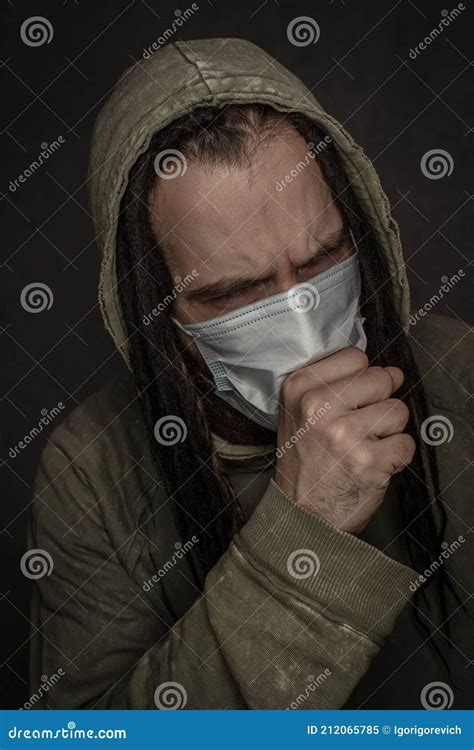 Coughing young man in mask stock image. Image of face - 212065785