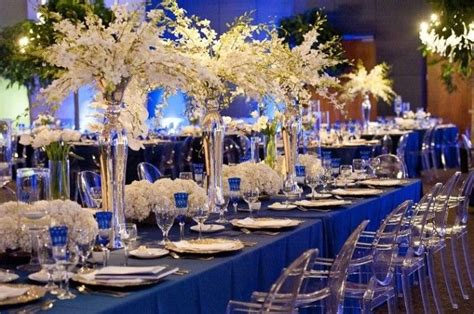 Tall and Low centerpieces on estate tables for a wedding reception. Wow! | Blue themed wedding ...