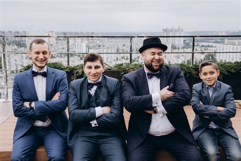 Men in Suits Sitting and Laughing · Free Stock Photo