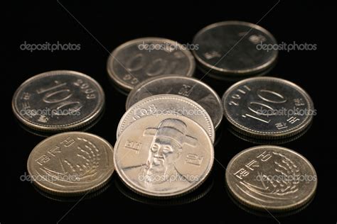 South Korean Won Coins On A Black Background — Stock Photo © tethysimaging #29984855