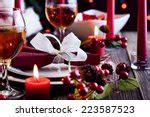 Photo of Christmas table decorations and glowing candle | Free christmas images