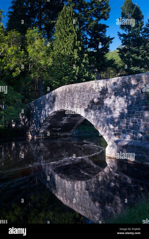 Bridge reflected in the Afon Elan river. Elan Valley, Wales Stock Photo ...