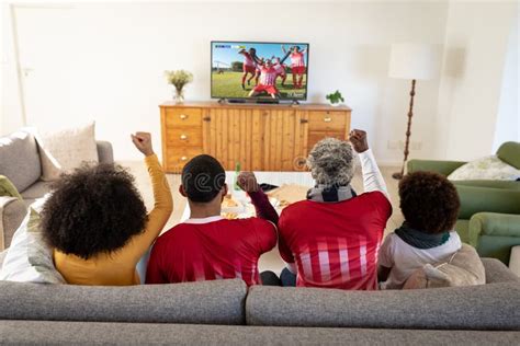 African American Family Watching Football Match Siting Together on the Couch Stock Image - Image ...