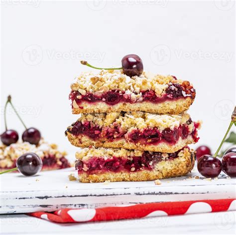 pile of baked cake with cherry 19581439 Stock Photo at Vecteezy