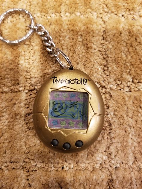 Tamagotchi. The original virtual pet. Here is my gold edition, still ...