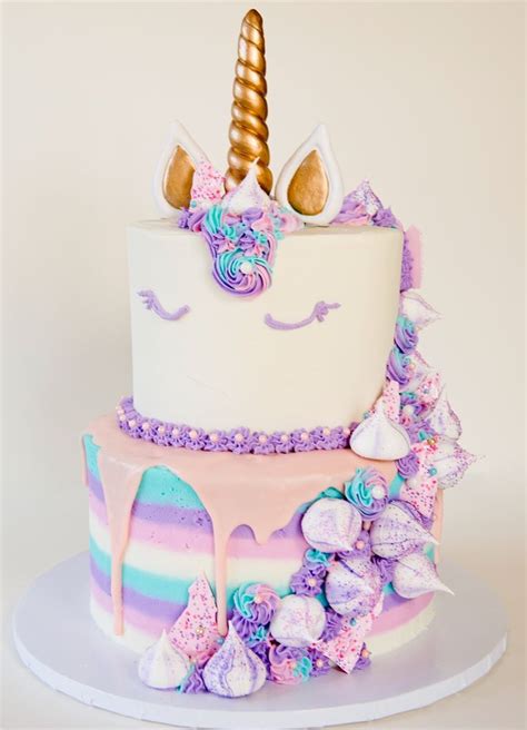 @jackiecellabakes Two tier unicorn cake with buttercream, meringues ...