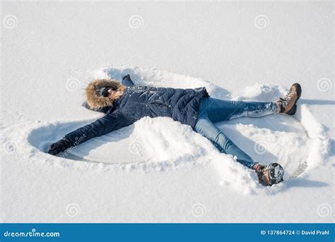 Making Snow Angels in Fresh Snow Stock Photo - Image of outdoors ...