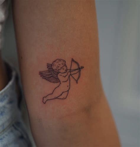 Cherub tattoo in 2020 | Cherub tattoo, Cupid tattoo, Maching tattoos