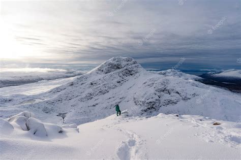 Premium Photo | Trekking on a snowy mountain