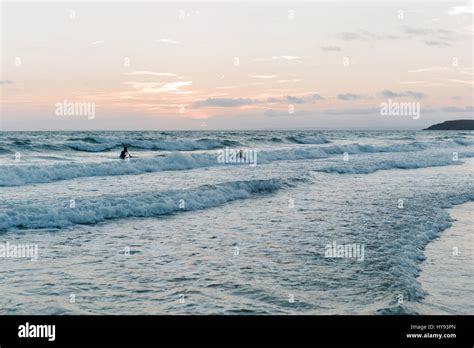 Teenagers enjoying the surf in Rhossili Bay, South Wales Stock Photo ...