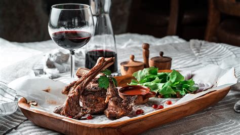 Why Red Wine Should Be Your Go-To Pairing For Lamb