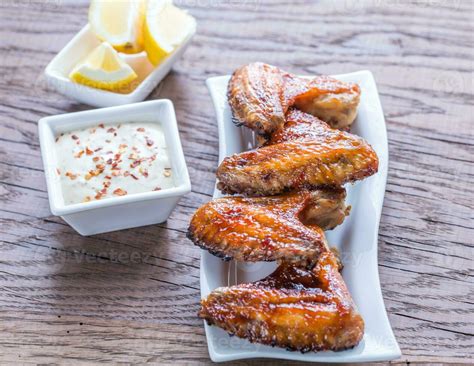 Baked chicken wings with spicy sauce 23491544 Stock Photo at Vecteezy