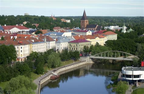 a river running through a city next to tall buildings