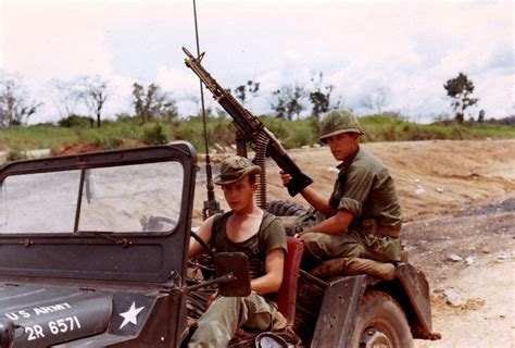 Men of the 70th Engineer Battalion in a jeep with a mounted M60 ...