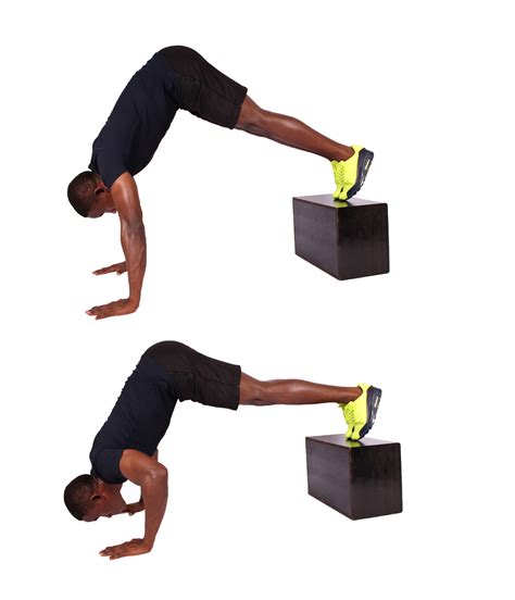 Fit Man Demonstrates How To Perform Pike Push Ups With Feet Elevated - High Quality Free Stock ...