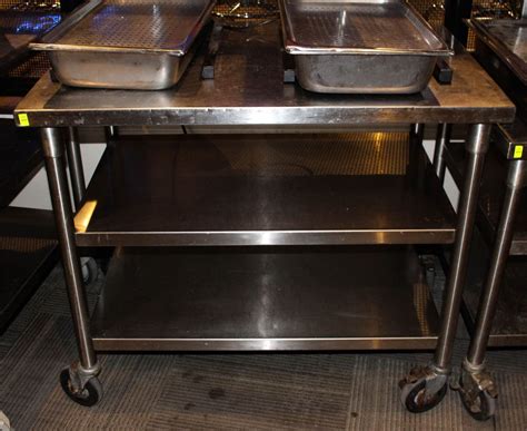 3 TIER STAINLESS STEEL TABLE ON WHEELS - Kastner Auctions