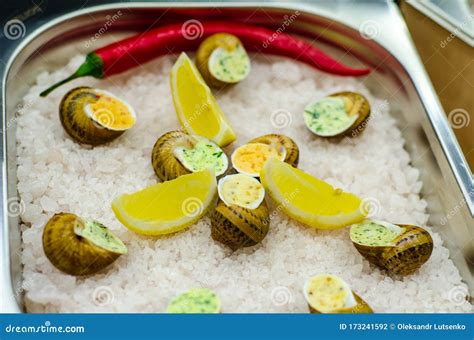 Helix Aspersa Muller, Maxima Snail. Edible Snails with Butter and Seasonings Stock Photo - Image ...