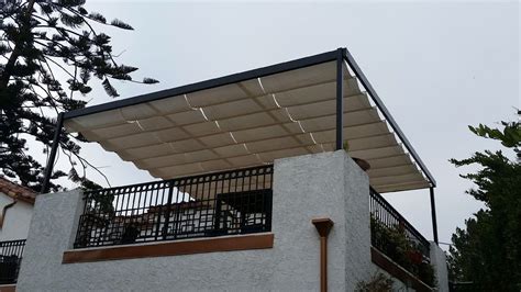 The custom steel structure featuring Infinity Canopy, was designed to frame the rooftop deck to ...