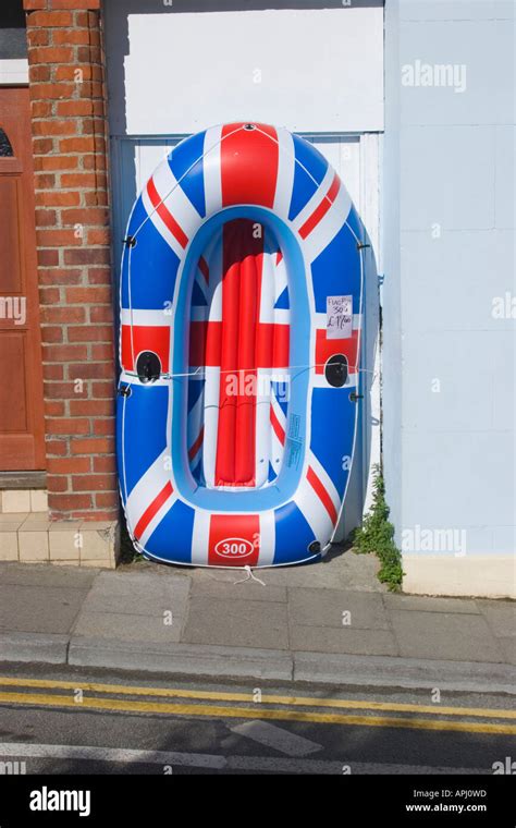 Inflatable dinghies on display outside a shop in Pembrokeshire Stock Photo - Alamy