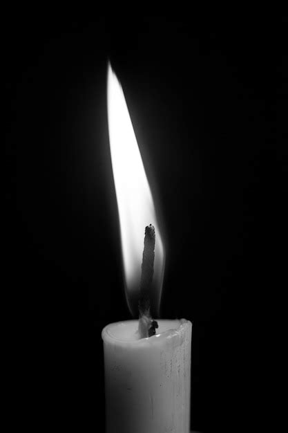 Premium Photo | Single candle in the dark