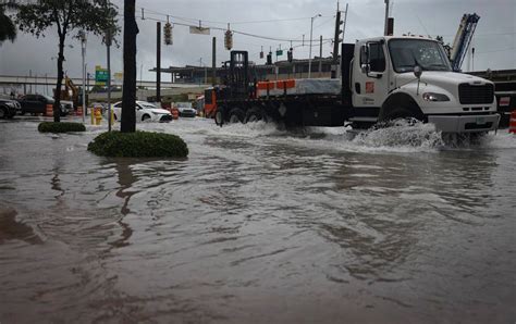 Rain is falling and streets are flooding in Miami. See for yourself what it looks like