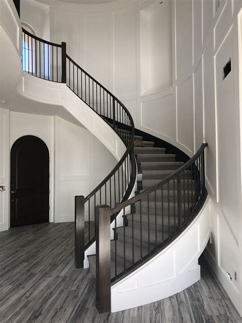 Contemporary wainscot with round staircase Entryway Stairs, Foyer ...