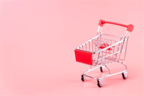 Free Photo | Shopping cart on plain background with copy-space