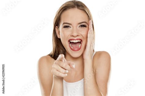 "beautiful laughing girl on white background pointing on you" Stock photo and royalty-free ...