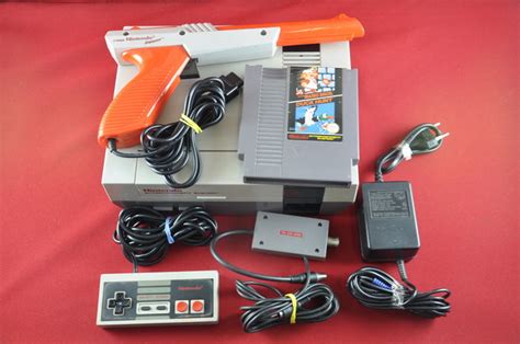 Complete Nintendo NES + Zapper en Super Mario Bros. / Duck Hunt game ...