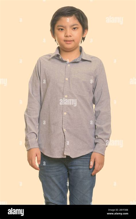 Studio shot of cute Japanese boy standing Stock Photo - Alamy