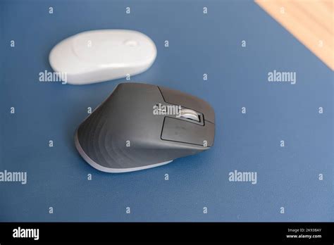 Comparison of Ergonomic vertical mouse and general mouse on desk at workplace, prevention wrist ...