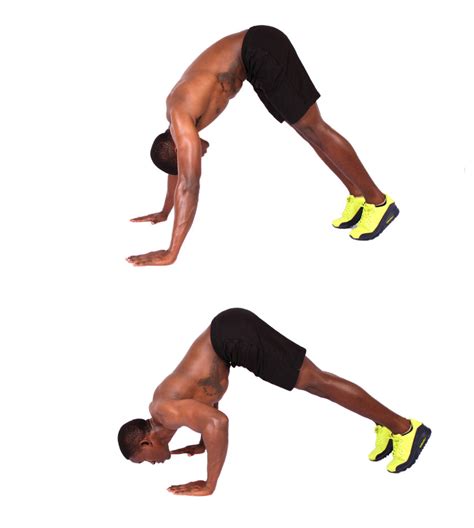 Muscular Shirtless Man Demonstrates How To Perform Pike Push Ups - High Quality Free Stock Images