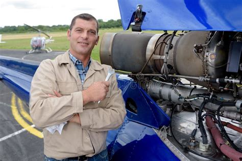 Helicopter Mechanic Posing Holding Wrench Stock Photo - Image of salary ...