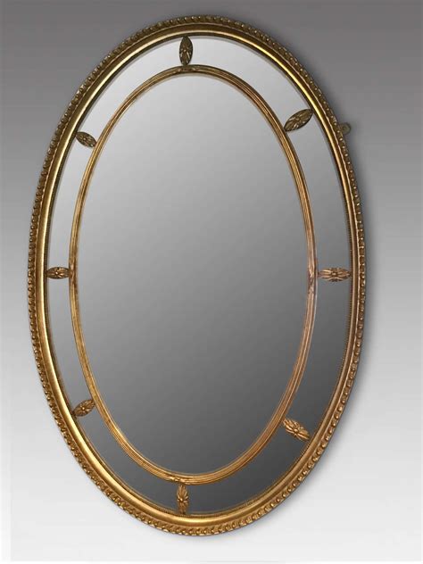 Antique gilt oval wall mirror in Antique Wall Mirrors