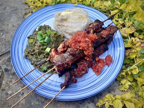 [homemade] Rwandan chicken & beef brochettes, isombe, & ubugali : r/food