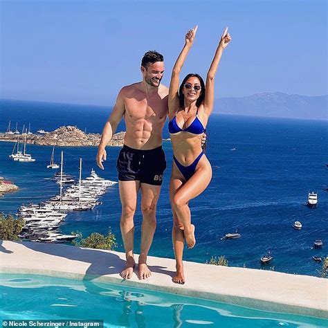 Newly engaged Nicole Scherzinger exhibits off her toned determine with fiancé Thom Evans in ...