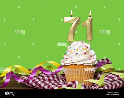 Birthday Cake With Candle Number 71 - On Green Background Stock Photo - Alamy