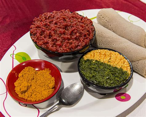 Ethiopian Kitfo - spice-marinated raw beef with extra spice, sides, and ...