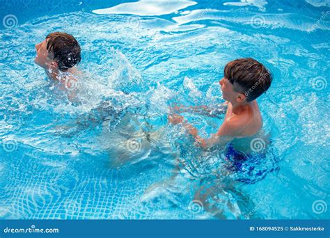 Happy Young Kids Splashing in Swimming Pool Stock Image - Image of play, laughing: 168094525