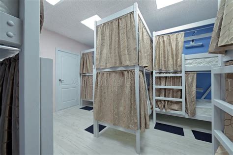 Hostel Room. Empty Bunk Wooden Beds with Fabric Curtains Stock Photo ...