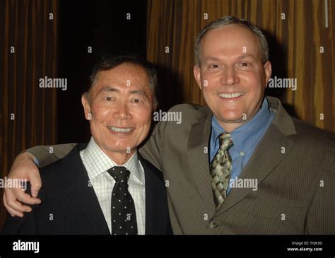 Actor George Takai of the Star Trek series poses with his life partner Brad Altman (r) at the ...