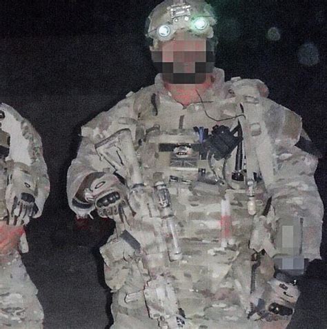 British 22 SAS operator pictured here during night time raids ...