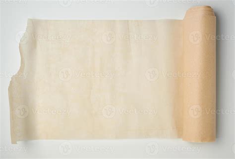 light brown roll with parchment paper spun on a white background ...