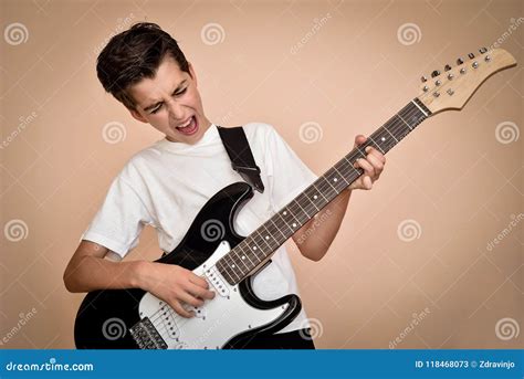 Young Boy Playing Electric Guitar Stock Image - Image of face, adolescent: 118468073