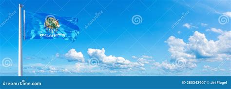 Oklahoma Flag - State of USA, Flag Waving on a Blue Sky in Beautiful Clouds - Horizontal Banner ...