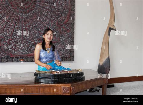 Woman playing khim, traditional Thai musical instrument. Phuket, Thailand Stock Photo - Alamy