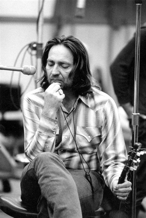 A young Willie Nelson lost in thought in the recording studio at Muscle ...