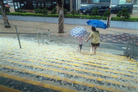 More Than 100 Injured In Hong Kong After Record Rain & Typhoon