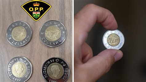 Counterfeit Toonies Have Popped Up In Ontario & Here's How You Can Spot A Fake - Narcity