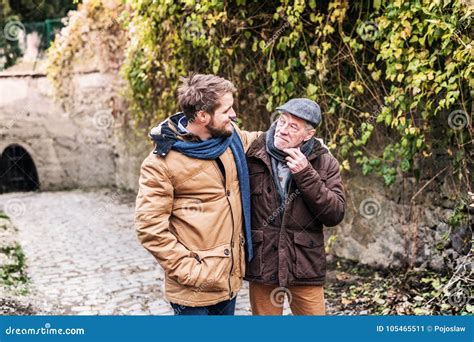 Senior Father and His Young Son on a Walk. Stock Image - Image of friendship, adult: 105465511